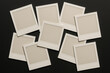 © H Ray - Blank Instant Photos Scattered on a Black Background, Ready for Memories