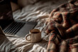 © ANGELINA - Cozy blanket with laptop and coffee cup on bed in natural light