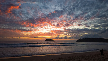 Wall Mural - wilight Serenity at Kata beach Phuket. Soft hues of orange, pink, and violet spread across the evening sky, merging with the calm sea in a breathtaking panorama of tropical beauty.