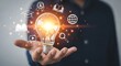 © ROJINA - Illuminating the Path to Knowledge Bright Idea Concept Featuring Light Bulb and Educational Icons in Hand Represents Innovation Learning and Global Connectivity