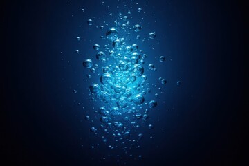 Wall Mural - A mesmerizing array of bubbles dances in the depths of a dark blue ocean, creating an ethereal underwater scene