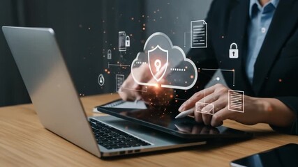 Person using tablet with digital cloud and security icons near laptop and smartphone on desk top