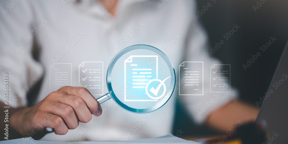 Businessman analyzing documents with magnifying glass and check mark ...