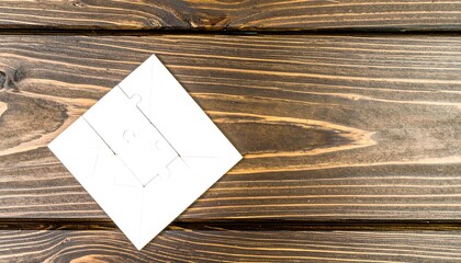 White puzzle on dark wood