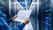 © pentem - Technician reviewing server room blueprints