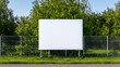 © THIBNH - large blank white poster mockup hanging on metal fence, playground park background. empty advertising space. billboard, signboard, advertisement, information display board. mockup template with area