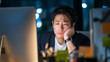 © kai - 深夜のオフィスで残業に疲れ果てるサラリーマンの姿「生成AI」