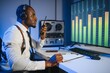 © Serhii - African american police officer records a telephone conversation on a tape recorder. secret agent