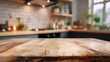 © Nahida - High definition photo of wood table top is positioned somewhat obscuring part of a blurred kitchen background with surrounding countertop visible._00002_.