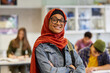 © Rido - Portrait of confident islamic girl student smiling in secondary school
