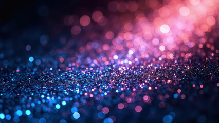 Abstract background of sparkling glitter in shades of blue and pink with bokeh effect creating a dreamy and festive atmosphere