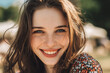 © Enrique - A beautiful european girl, toothy smile, under sunshine in a park
