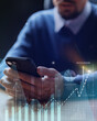 © fotofabrika - Professional analyzing financial data on smartphone during busy office hours for investment strategies