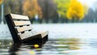 © tashechka - Flooded park bench surrounded by water and autumn trees during rain