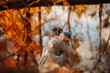 © Halfpoint - Grandad and grandson hugging in the middle of autumn park.