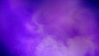 © Leo Lintang - Purple background with smoke and steam. The smoke is thick and dark, and the steam is rising from the ground. Dramatic smoke or fog effect. Mockup. Copy Space. Wallpaper or Halloween background