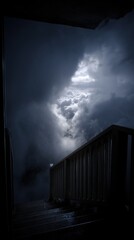 Wall Mural - Dramatic Low Angle of Stairs Leading to Stormy Sky with Clouds and Sunlight in Moody Lighting