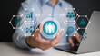 © Mahamud - Person holding a glowing human resources icon surrounded by business technology hexagons