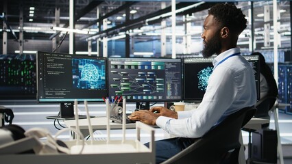 Server hub admin using AI neural network node tree program to optimize system health. Data center IT professional analyzing equipment issues using deep learning AI visualization, camera A