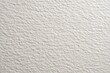 © Shofiyah - Close-up view of textured off-white paper.  Fine, subtle ridges and bumps create a subtle, uniform surface pattern