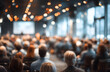 © john - Blurred photo of business presentation in modern conference room. Focused audience listens to speaker. Corporate seminar workshop with interaction, learning opportunities for company employees,