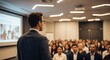 © ChaGha Studio - A realistic over-the-shoulder view of a man wearing glasses, speaking in front of a large audience in a modern conference or seminar room