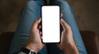 © Creativa - Man Holding Smartphone with Blank White Screen