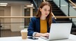 © Dev Forge - Woman working on laptop in office space, remote work concept, business professional, modern workplace design