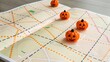 © CreativeLoom - Halloween-themed map with decorative pumpkins on it.