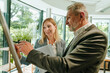 © Westend61 - Business colleagues brainstorming ideas together in modern office
