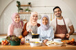 © Velocitystock777 - Portrait Of happy Muslim family cooking in modern Kitchen