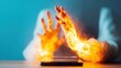 © tashechka - Hands engulfed in flames reaching toward a glowing smartphone screen