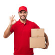 © KC.STUDIO - Confident Delivery Man with OK Sign and Packages