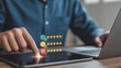 © Amit - Customer Feedback: A hand interacts with a tablet interface to provide valuable customer feedback through rating and evaluation tools, focusing on user experience.