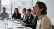 © Luiz - Man yawning widely during a business meeting with colleagues sitting at a conference table
