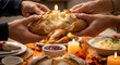 © ManuStockStudio - Family sharing freshly baked bread during a warm and inviting Thanksgiving holiday feast tradition