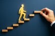 © Pixels Hunter - Businessman silhouette stepping up wooden blocks with assistance on dark blue background, symbolizing career growth and success concept.