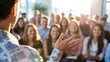 © Bishojit - Speaker engages audience with enthusiastic gesture during presentation