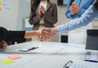 © crizzystudio - Businesswomen shaking hands after successful meeting