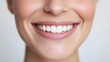 © vadosloginov - Happy young woman smiling in studio during daytime close-up