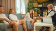 © master1305 - Family psychotherapy session with psychologist holding hands of teenage daughter. Concept of parental support, emotional healing, adolescent counseling and mental health guidance.