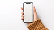 © haidar - Smartphone mockup on hand with white blank screen created