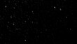 © iskandar - Falling Snowflakes Against a Black Background