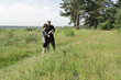 © yta - Exploring summer meadow full of wild herbs and flowers, father and daughter bonding during slow-paced nature walk, highlighting simplicity, ecology, and rural leisure.
