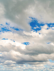 Wall Mural - Cloudy skyscape background. Cloudscape sky background. Cloud in the sky. Background with cloud. Gloomy sky with overcast clouds. Skyscape and cloudscape. Color contrast. Sky with clouds
