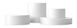 © Onyx - Three stacked white cylindrical display risers