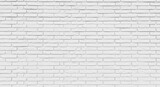 Clean white brick wall texture provides a versatile, modern backdrop for any design project.