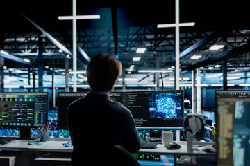 Server room IT worker deploying AI tools to automate repetitive workflows. Data center programmer managing large datasets used in AI training procedures to streamline tasks