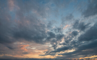 Wall Mural - Evening sunset sky background with bright dramatic clouds.