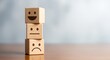 © MstRahima - Wooden blocks with happy, neutral, and sad faces for customer feedback concept